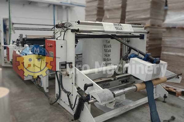 11116 roll bag making machine COMMACHINERY Newer model roll bag making machine with photocell for printed film and double sealing bar.